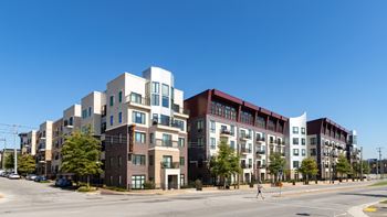 A large apartment complex with multiple buildings and balconies.